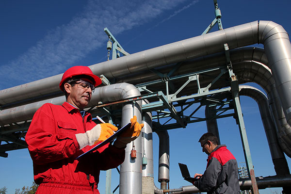 image of engineers inspecting Oil and Gas pipelines